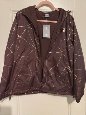 NWT New Balance Women's Brown Reflective Windbreaker Jacket. Burgundy & Gold.